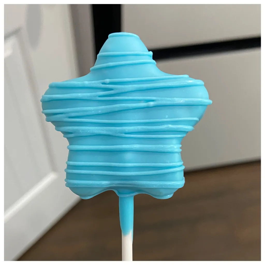 A Blue Drizzly Star Cake Pop